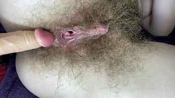Hairy girl fucks her wet big clit pussy with dildo
