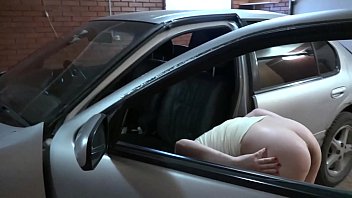 A girl washes a car and then masturbates her ass