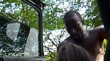 Beautiful wife with a black beggar