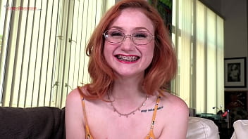 Watch the braces as redhead cute girl Scarlet Skies sucks