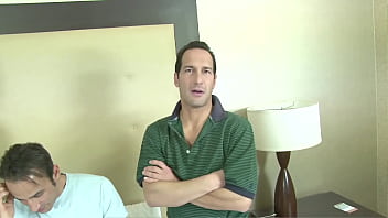 Surrounded by several men she sucks as many cocks as