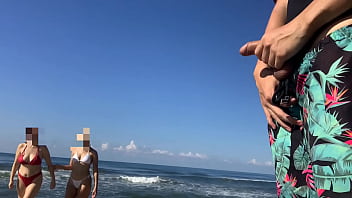 I take out my cock on the public beach to