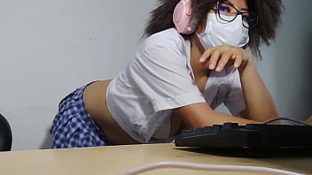 Beautiful student is getting excited while singing while doing homework