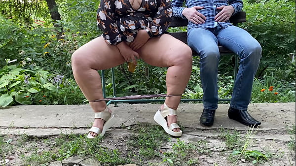 Sexy MILF with gorgeous legs pisses into a glass and