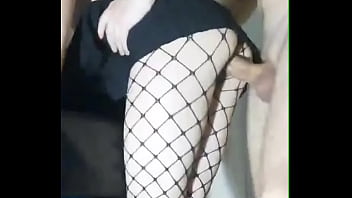 Slender girlfriend in a skirt and stockings fucked while standing