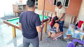 My friends play pool while one puts his penis in