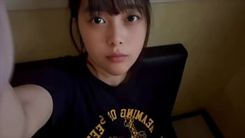 A female college student masturbates alone in a private room