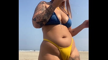 Married redhead stays on the beach teasing her virgin friend