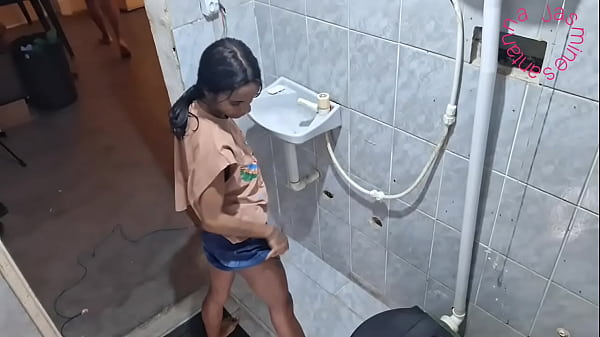 Giving her ass in the bathroom while her friend is