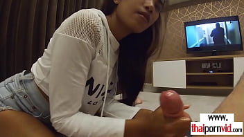 Amateur Thai teen Cherry giving a sensual handjob to a
