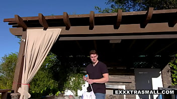 Tiny blonde cutie Coco Lovelock is out in the backyard