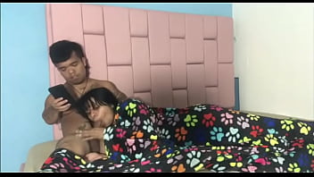 While my stepbrother concentrates on his cell phone watching porn