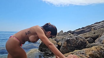 A fisherman on the rocks wants to give me his