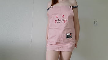 Cute girl in a pink sundress jerks off her pussy