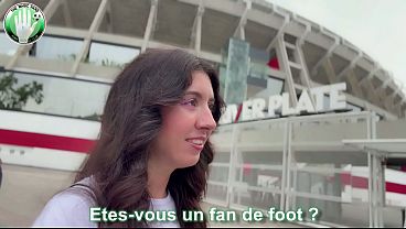 I meet a football fan in front of the stadium