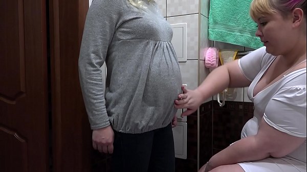 A nurse makes for a pregnant milf milky enema in