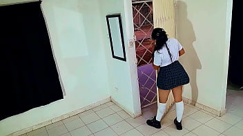 Young student in college uniform gives a blowjob to unknown