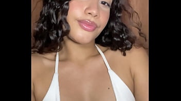 Innocent girl with a tender face masturbates her pussy in