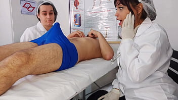 Two nurses are surprised by the patient's erection